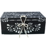 A black and white hand-painted wooden storage box. An antique nautical chest upcycled using Annie Sloan paint. Rustic wooden chest perfect for storage, suiting coastal décor.