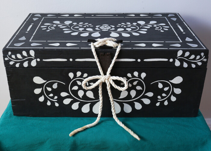 Hand painted storage wooden box in black and white with rope fastening. Painted using Annie Sloan paint. Upcycled using stencils.