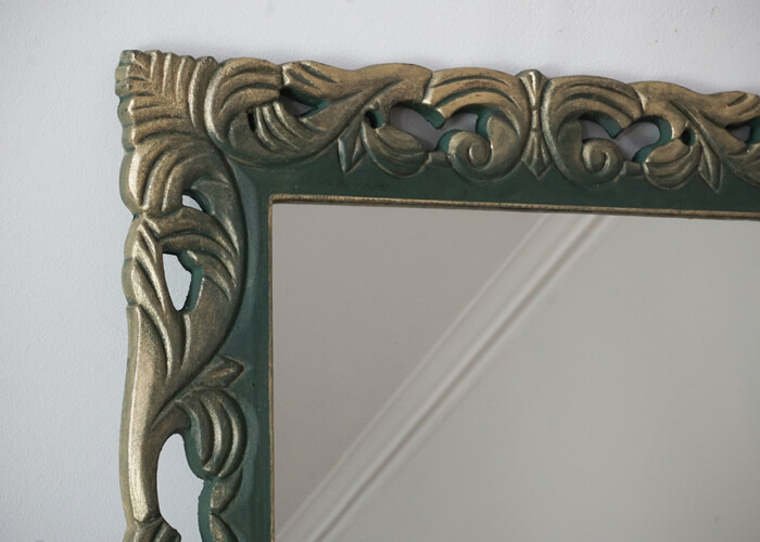 A close up of the gold leaf edges on the dark green gothic mirror painted in Annie Sloan's Amsterdam Green