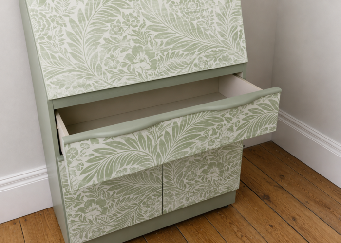 Green teak bureau painted in Fusion Mineral paint Bellwood with distressed floral front with drawer open reveal interior painted in Bellwood.