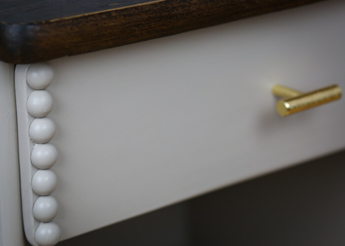 Close up of the decorate beading of the bedside table